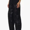 Pantaloni a zampa con paillettes